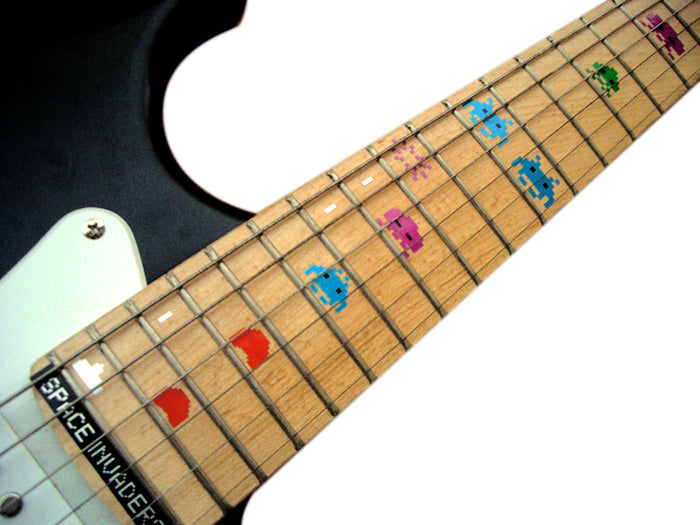 Guitar fretboard with colorful dot inlays