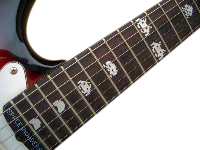 Guitar neck with pixelated 'Space Invaders' design