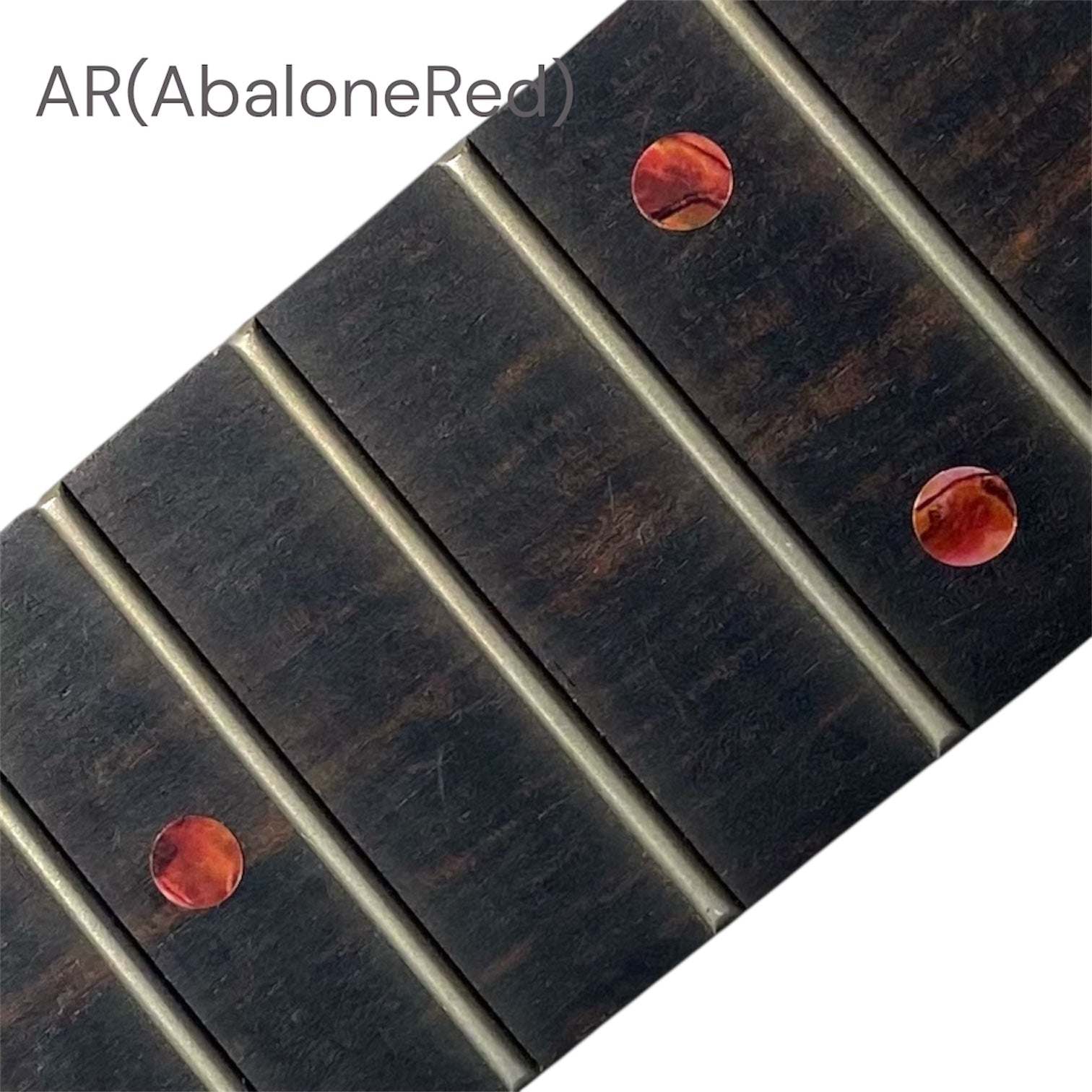 Close-up of a guitar fretboard with abalone red dot inlay stickers