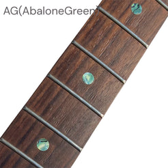 Close-up of a guitar fretboard with abalone green dot inlay stickers