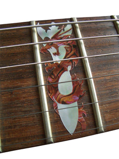 Close-up of a guitar fretboard with decorative inlay