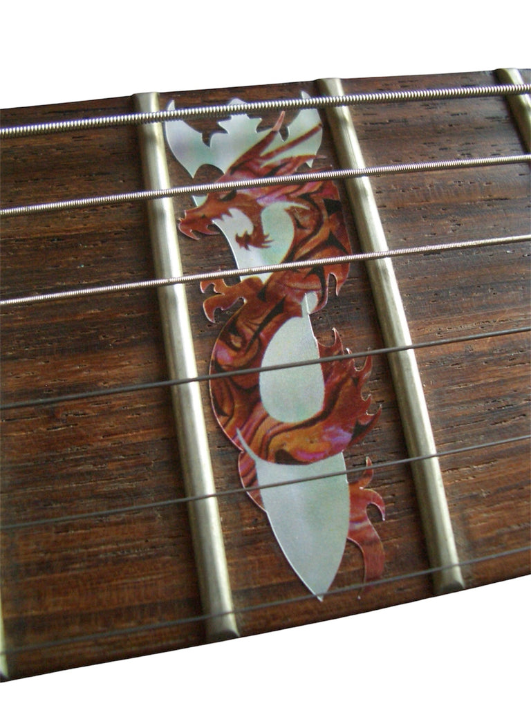 Close-up of a guitar fretboard with decorative inlay